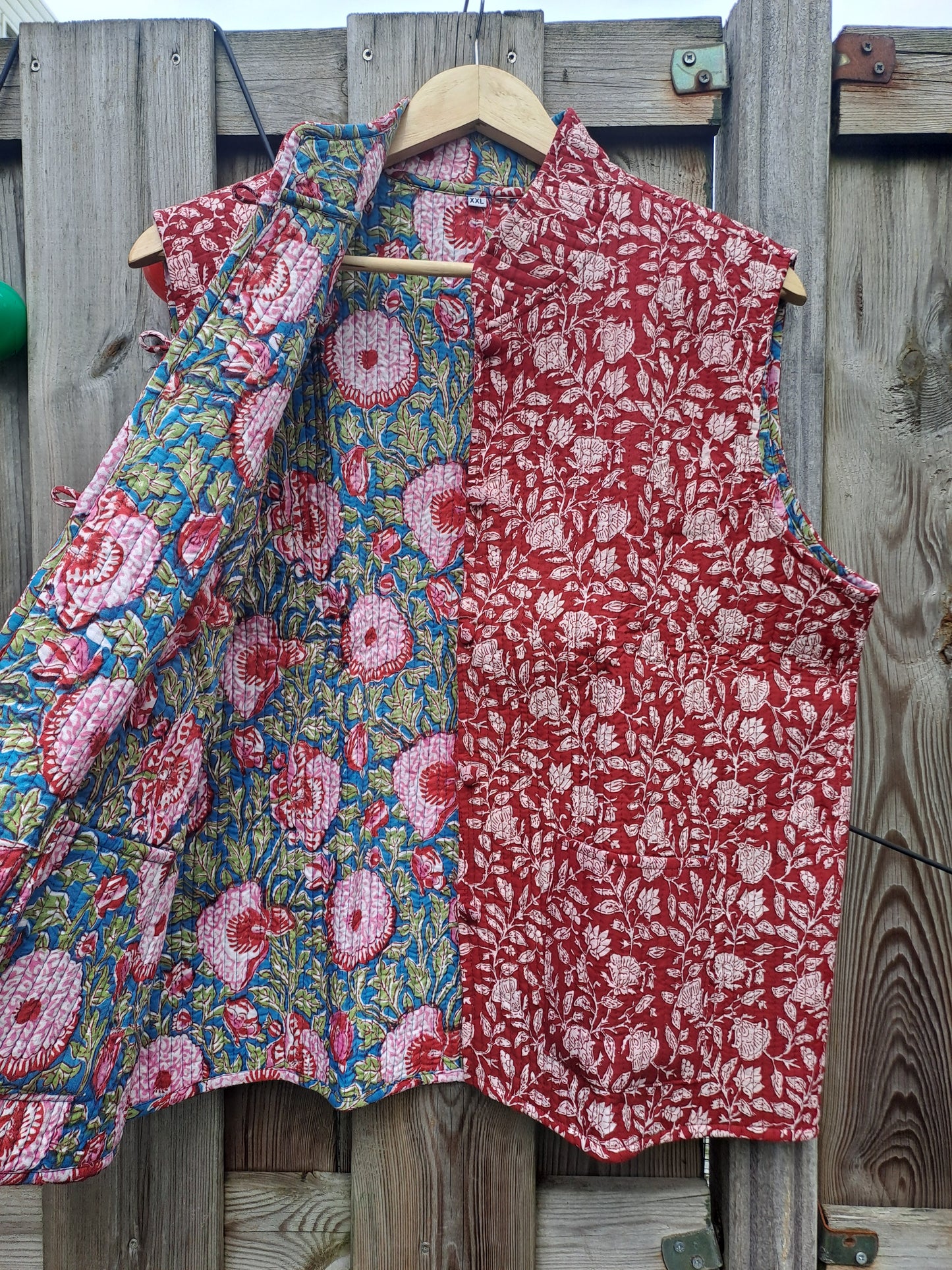 Gilet blauw roze/rood